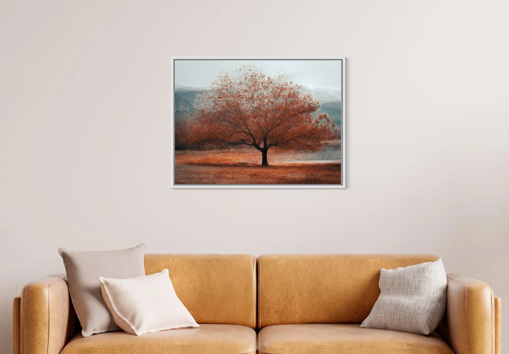 tableau photo accroché au dessus dun canapé jaune en cuir arbre axel niqueux